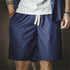 Retro washed denim shorts for men in tencel-blend fabric with elastic waist.